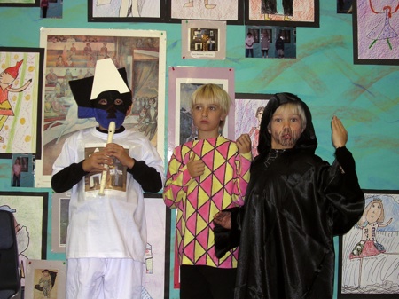Three students modeling as musicians.